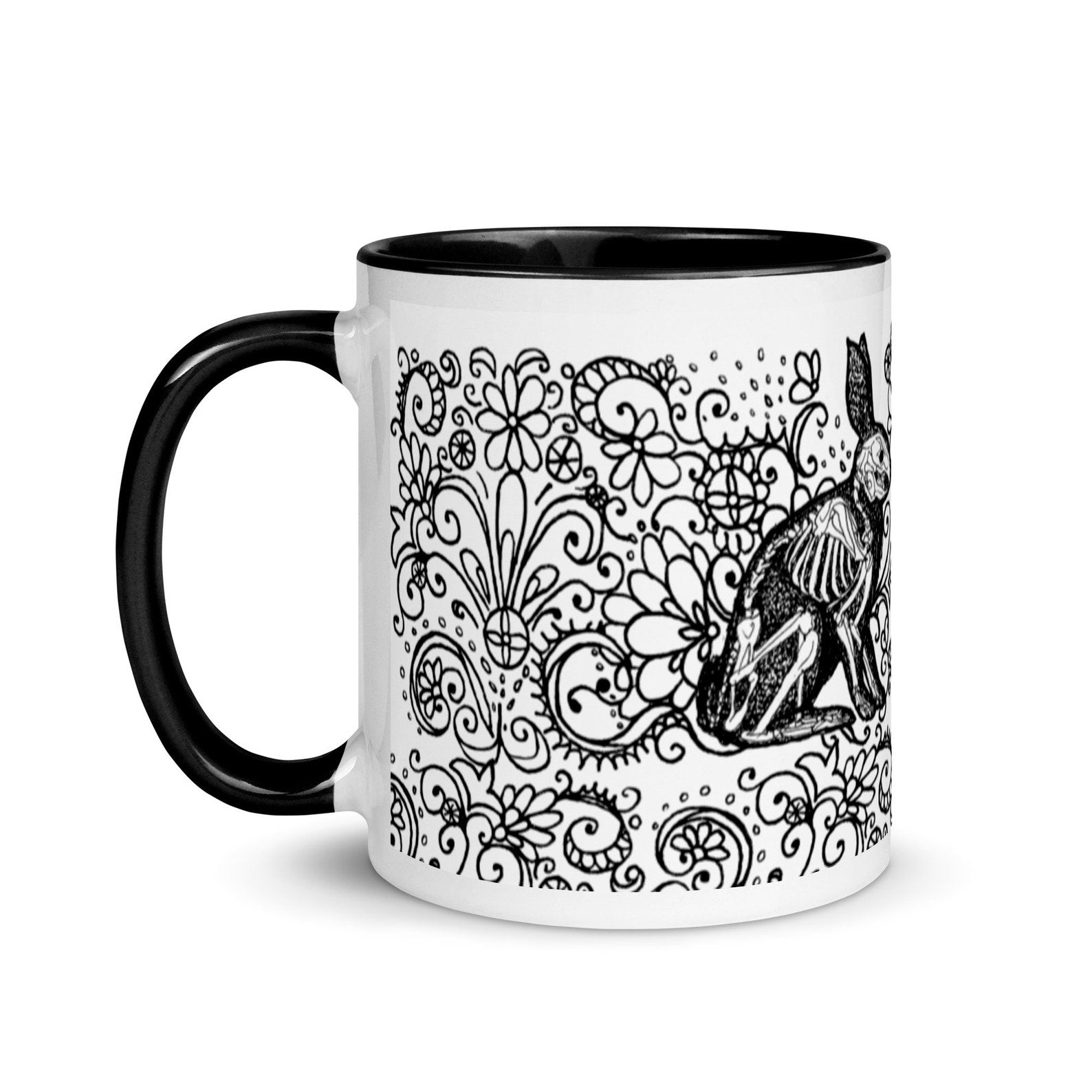 ceramic halloween mug. Two black bunny rabbit silhouettes with their skeletons visible, on a field of elaborate, black, floral swirls on a white background. Side view showing a black handle.