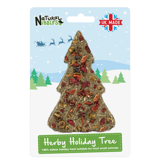 Hay based treat for rabbits shaped like a Christmas tree on a branded packaging with 'Natural Nibbles' logo.