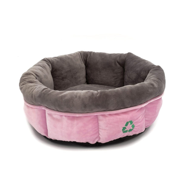 Plush recycled pet bed made with dark grey interior and pink exterior. With a green recycling symbol on the front.