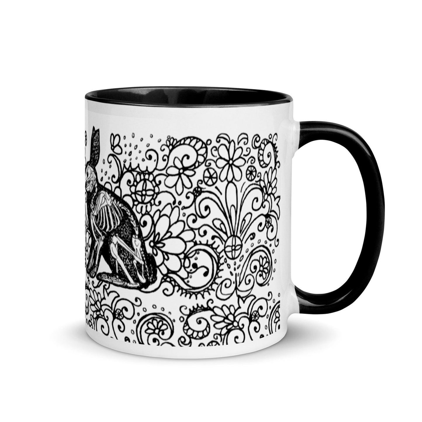 ceramic halloween mug. Two black bunny rabbit silhouettes with their skeletons visible, on a field of elaborate, black, floral swirls on a white background. side view showing a black handle.