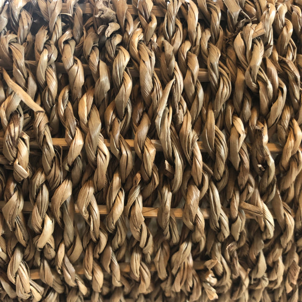 Snazzy close up of Rosewood rabbit tunnel made of seagrass and rattan, showing woven seagrass over rattan frame.