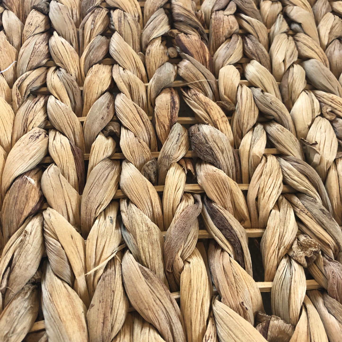 Snazzy close up of Rosewood chill n chew mat large size for rabbits showing texture of water hyacinth platted across a rattan grid.